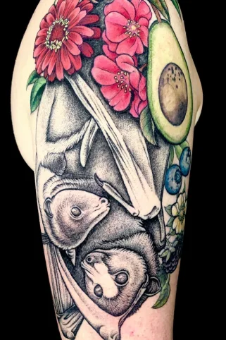 Dotwork floral bats tattoo with intricate botanical details