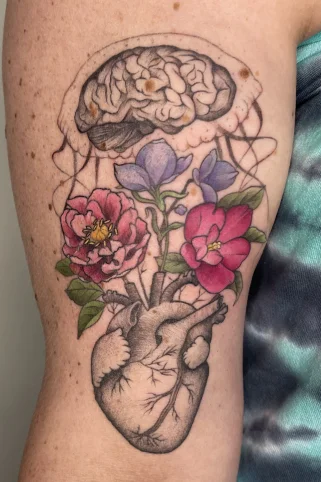 Dotwork floral jellyfish tattoo with botanical elements