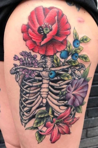 Floral ribcage tattoo with beautiful botanical design