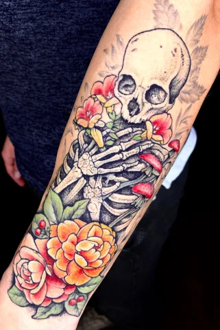 Floral skeleton ribcage tattoo with delicate botanical elements