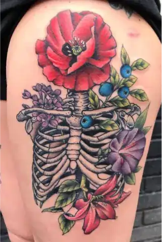 Floral ribcage tattoo with beautiful botanical design