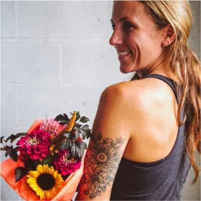 Healed floral bouquet tattoo with beautiful botanical arrangement