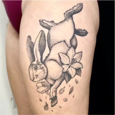 Healed nature rabbit tattoo with whimsical animal and botanical elements
